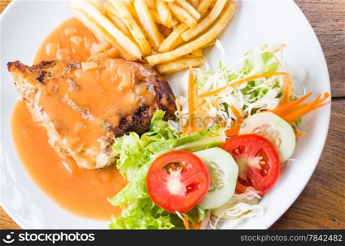 Grilled chicken steak in tomato&rsquo;s sauce, stock photo