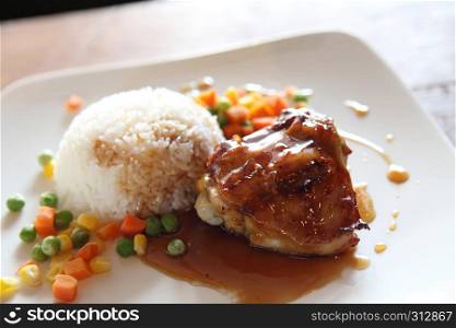 Grilled Chicken teriyaki rice on wood background
