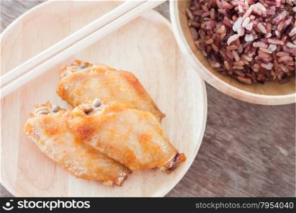 Grilled chicken wings with multi grains berry rice, stock photo
