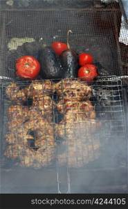 Grilled chicken with a tomato and eggplant