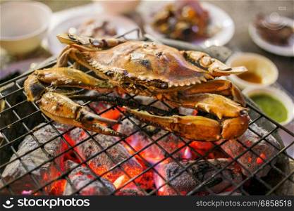 Grilled crab on a flaming grill, Thailand street food