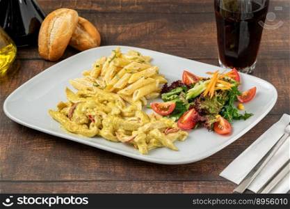 grilled cubed chicken with pasta and salad