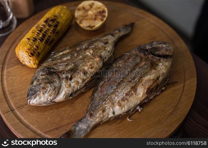 Grilled dorado fish. Grilled dorado with vegetables preparing