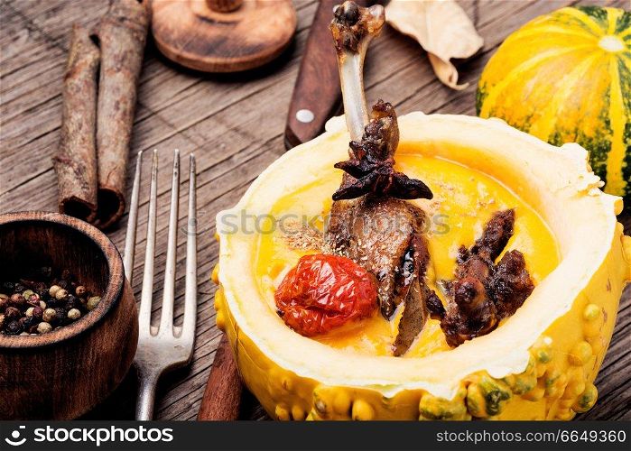 Grilled duck legs baked in pumpkin puree.Dietary meat.Italian food. Baked duck leg in pumpkin puree