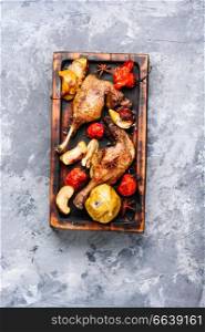 Grilled duck legs baked with apples and vegetables. Dietary meat.Cooking at Christmas time. Baked duck leg