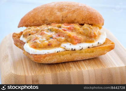 Grilled eggplant mozzarella bruschetta on the wooden plate