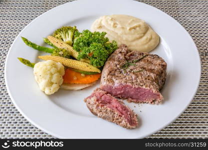 grilled fillet steak served with grilled vegetable and mash potato