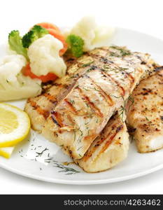 Grilled Fish Fillet With Vegetables And Lemon