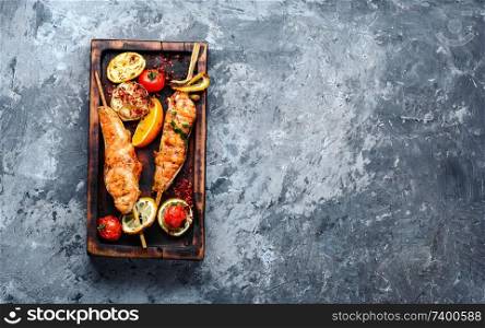 Grilled fish, grilled salmon steak with addition of lemon. Grilled salmon steaks