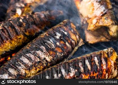 Grilled fish on charcoal grill. Fresh fish barbecue