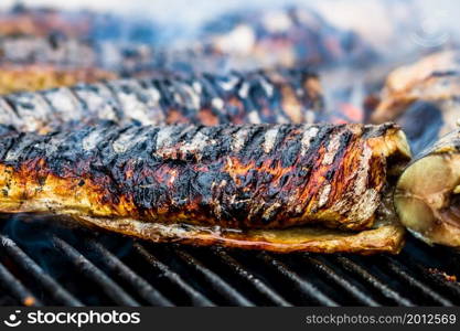 Grilled fish on charcoal grill. Fresh fish barbecue