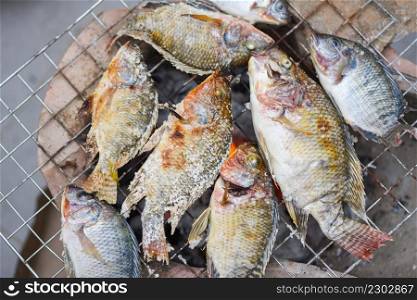 grilled fish on the grill, Tilapia fish grilled with salt cooking fish burn Thai food