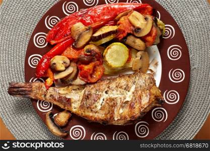grilled fish with baked vegetables. homemade healthy food