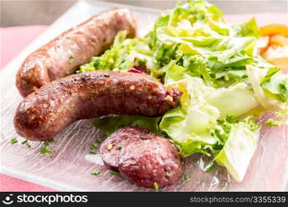 grilled german sausages serve with fresh vegetable
