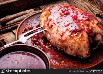 Grilled healthy chicken breasts with cranberry sauce. Chicken breasts with cranberry sauce