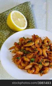 GRILLED HONEY GARLIC SHRIMP AT PLATE ON WOODEN TABLE