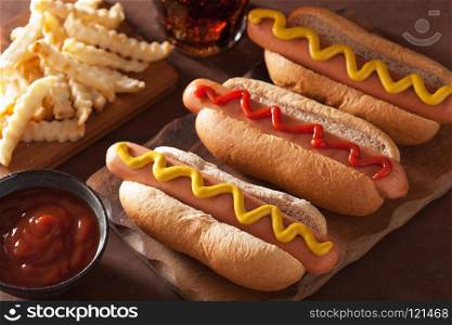 grilled hot dogs with mustard ketchup and french fries