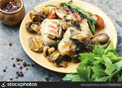 Grilled juicy steak with mushrooms on plate.Meat food. Grilled meat with mushrooms