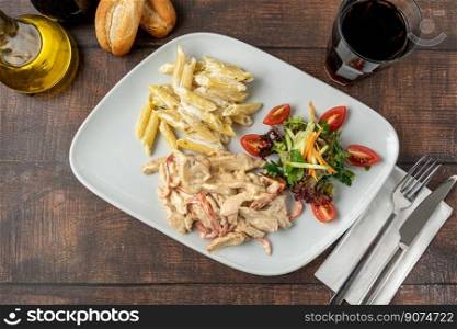 Grilled julienne cut chicken with pasta and salad
