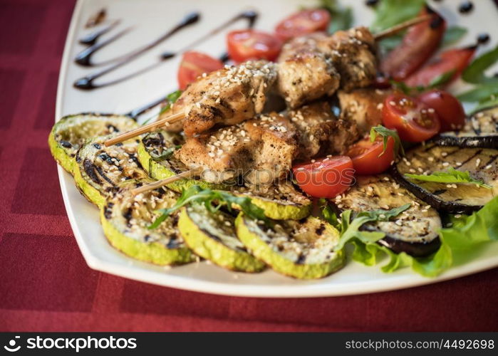 Grilled kebab pork meat. Grilled kebab pork meat with roasted potato and vegetables