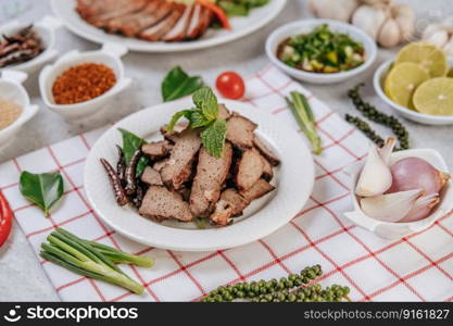 Grilled Liver Slices with sliced   lime, carrots, chili, spring onions, and mint.