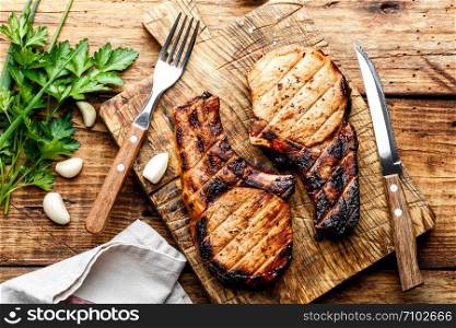 grilled meat, a portion of two pork loin steaks barbecue