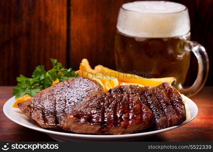 grilled meat and mug of beer