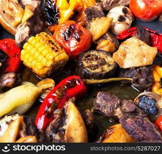 Grilled meat and vegetables. Background food.Vegetables and grilled meat with spices