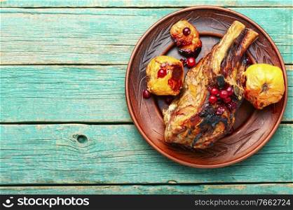 Grilled meat barbecue steak with quince.Grilled steak on wooden table.Space for text. Grilled meat steaks