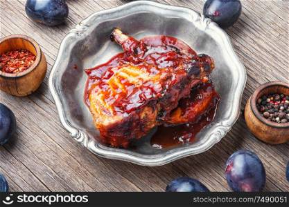 Grilled meat. Grilled meat with autumn plum.Bbq. Grilled meat in plum sauce
