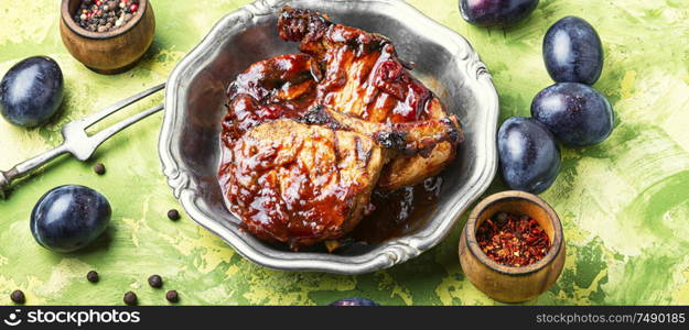 Grilled meat. Grilled meat with autumn plum.Bbq. Grilled meat in plum sauce