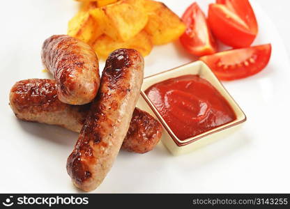 grilled meat sausages with potatoes and tomatoes