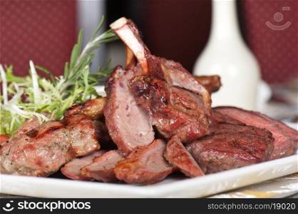 grilled meat with herbs and vegetables. grilled meat