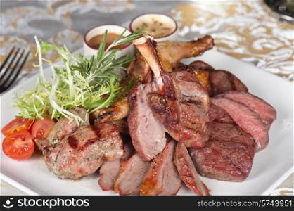 grilled meat with herbs and vegetables. grilled meat