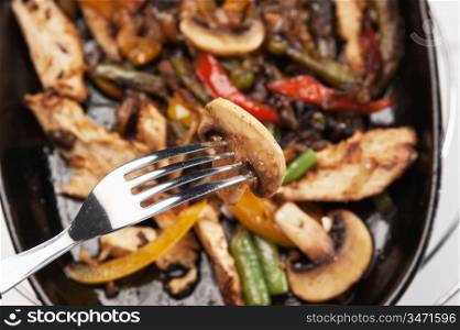 grilled meat with mushrooms and vegetables isolated on white background