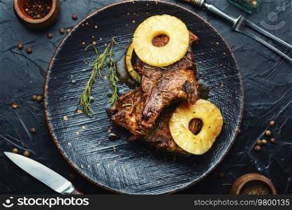Grilled meat with pineapple. Grilled pork chop with pineapple. Roasted meat in marinade, barbecue