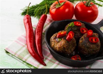 Grilled meatballs with chili pepper. Meatloaf. Meatballs.Grilled meatballs. Turkish meatball. Fresh vegetables. Chili pepper.. Grilled meatballs with chili pepper