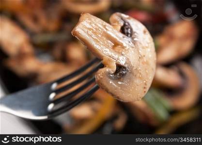grilled mushroom on a fork