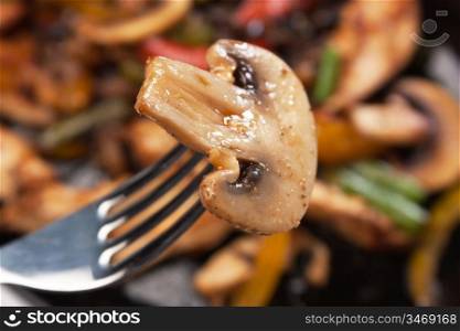 grilled mushroom on a fork