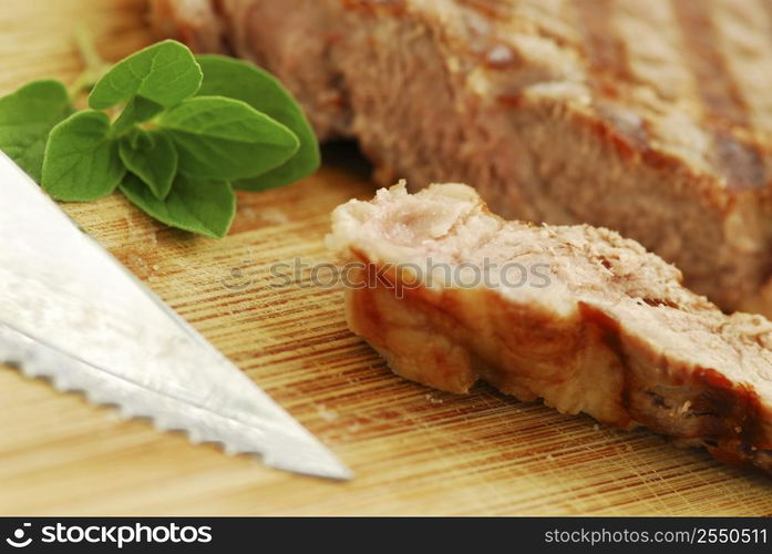 Grilled New York steak cut on a cutting board