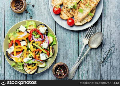 Grilled pepper, eggplant and zucchini salad.Vegetable grilled salad.Fried vegetables. Grilled vegetables salad on plate