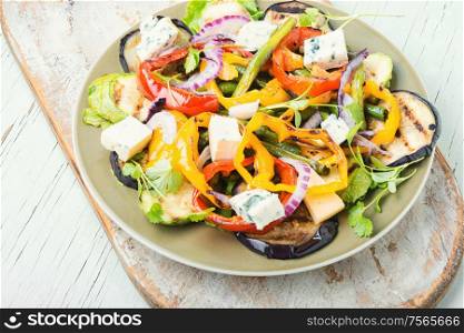 Grilled pepper, eggplant and zucchini salad.Vegetable grilled salad.Fried vegetables. Grilled vegetables salad on plate