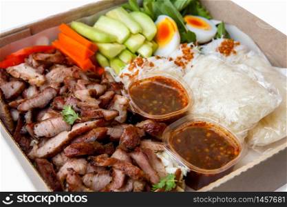 Grilled pork, boiled eggs, fresh vegetables and sticky rice Food delivery in Thailand during the corona virus epidemic
