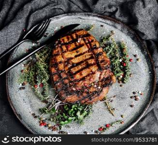 Grilled pork chop dish with spices on a plate