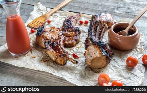 Grilled pork ribs on the wooden background