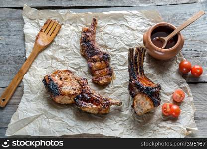 Grilled pork ribs on the wooden background