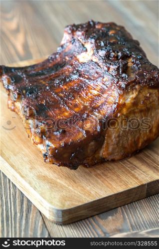 Grilled pork ribs on the wooden board