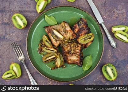 Grilled pork ribs with kiwi sauce. Barbecue meat. Pork ribs in fruit marinade