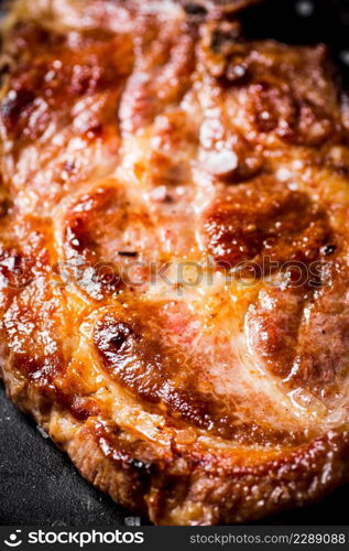 Grilled pork steak. Macro background. High quality photo. Grilled pork steak. Macro background.