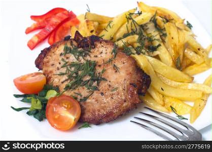 Grilled pork steak on white plate. Isolated
